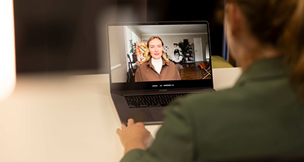 Person on a computer screen looking at the person at the computer screen