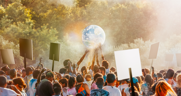 Diverse crowd raises blank protest signs and a glowing globe in a sunlit forest, creating a hopeful, united atmosphere for climate action