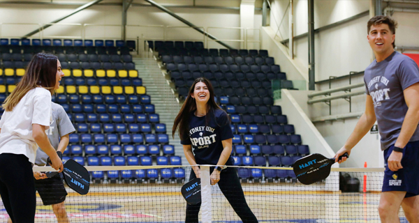 Students playing indoor sport