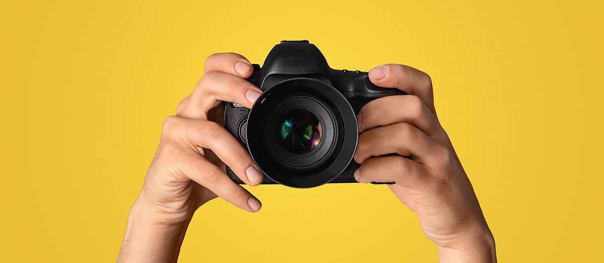 Camera on yellow background