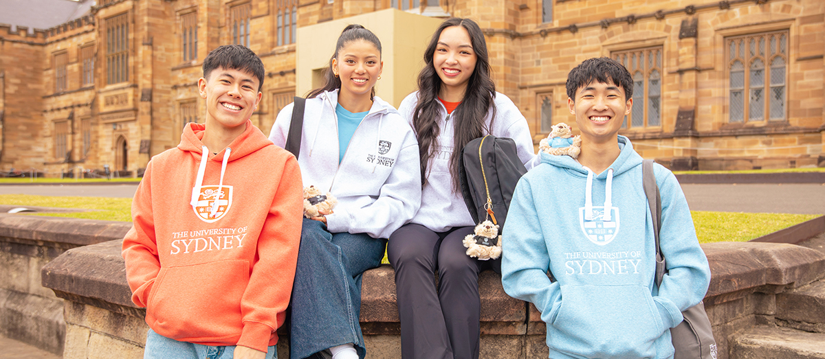 Students on the Quad lawns wearing USYD hoodies