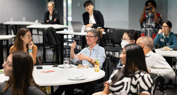 Researchers chatting in a workshop