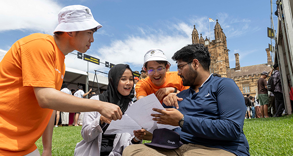 Student Life Ambassadors (orange shirts) assist students at Welcome Fest