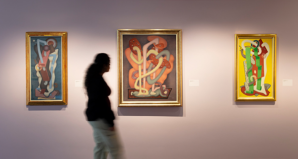 A student walks past artwork at the museum