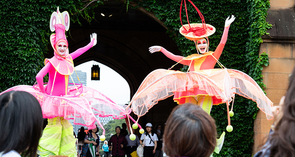 Performers on stilts at the Community Festival