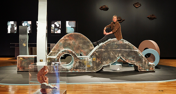 Dr Sanne Mestrom atop one of the sculptures