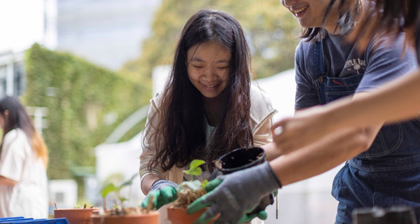 students at a balcony gardening workshop funded by Student Life Grants.
