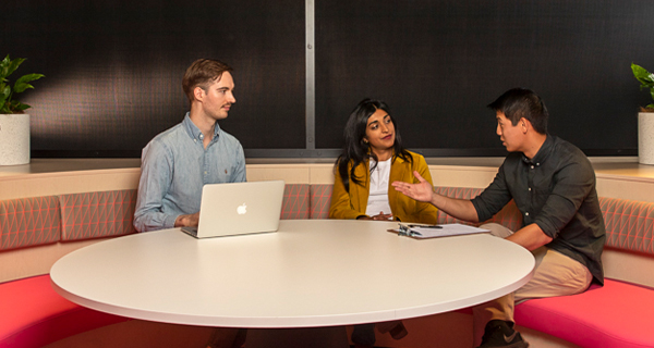 Students studying around a desk