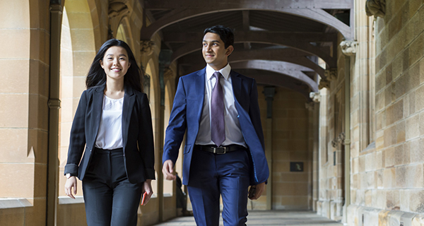 Two students walking in The Quad