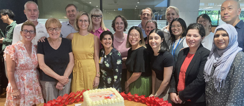 The myResearch team with a cake