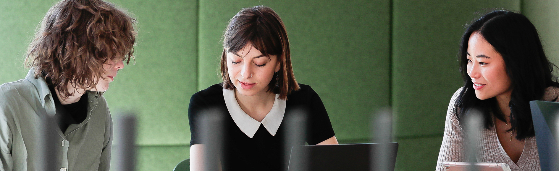 Female students looking down together