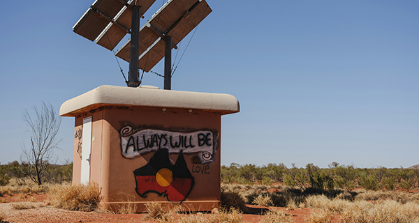 A power box displaying ''always will be'' and Aboriginal flag artwork
