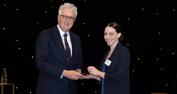Mark Scott presenting a graduate medal