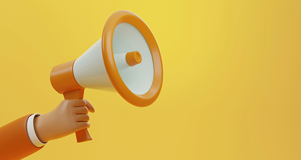 A graphic of a hand holding a megaphone on a yellow background