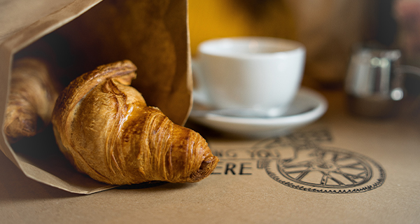 A coffee and croissant