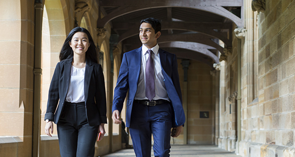 Two students walking in The Quad