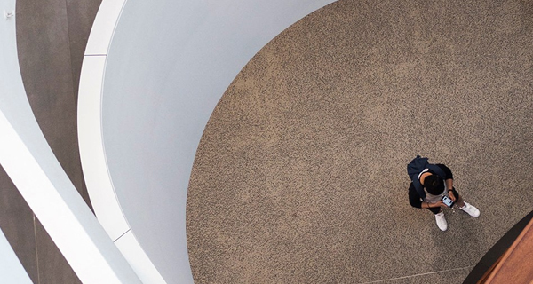 a student on phone in Abercrombie, aerial shot