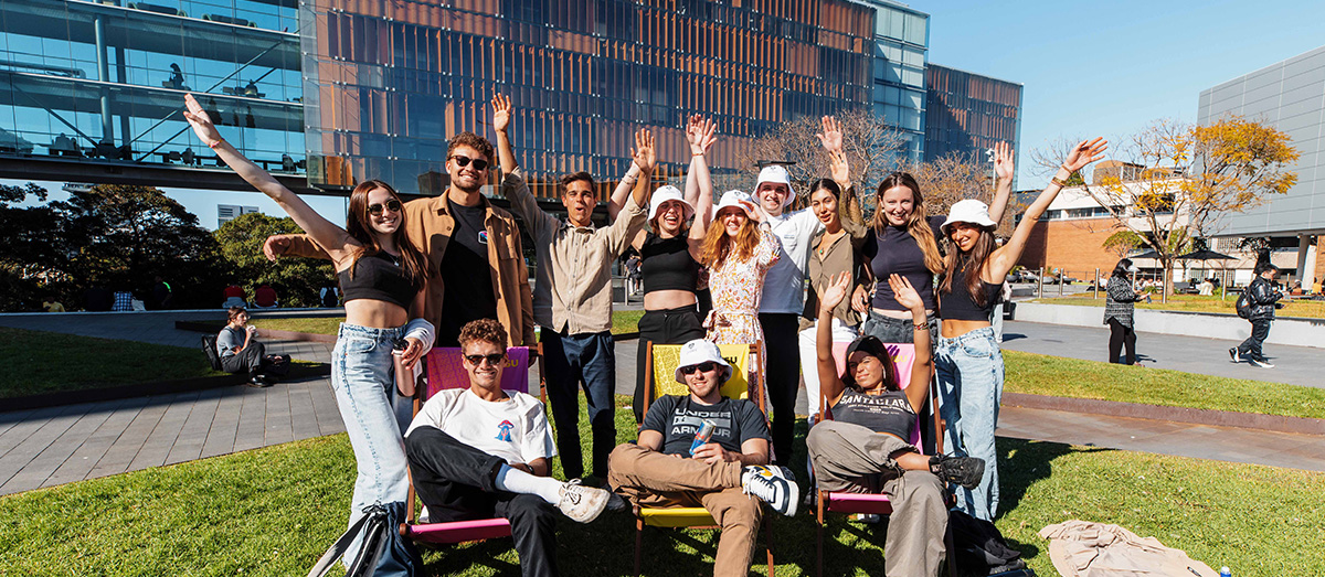 Students sitting on deck chairs at Welcome