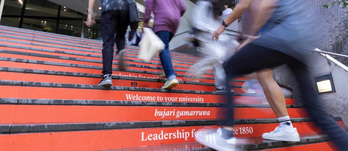 Students walking up the steps at JFR Plaza